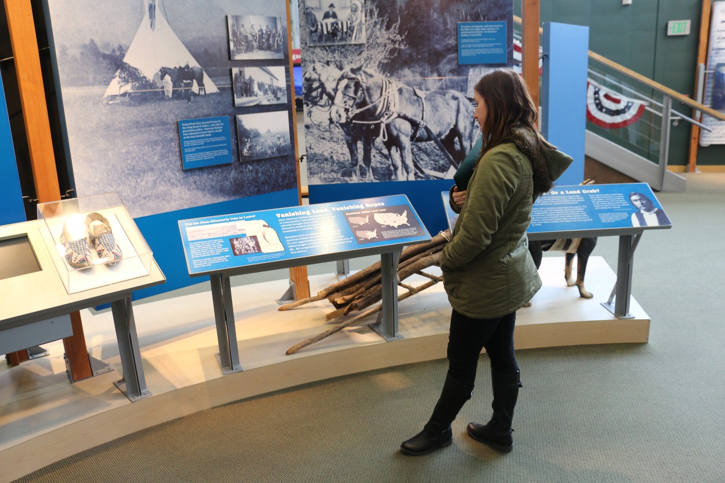 A woman touring the exhibits inside the Homestead National Monument of America.