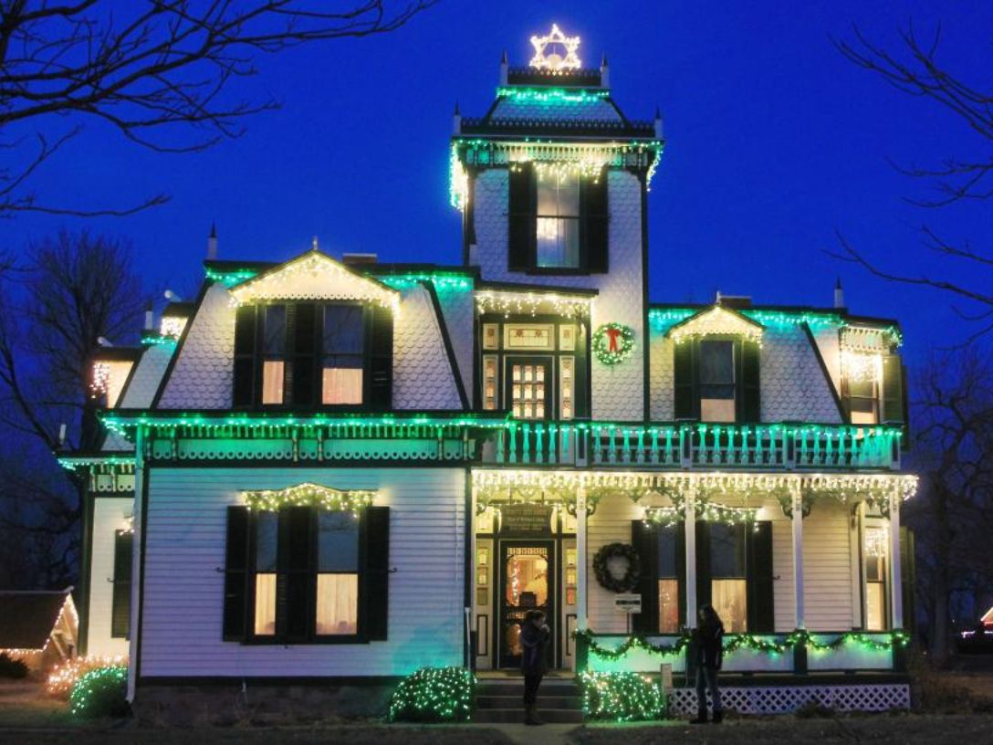 Green lights illuminating Buffalo Bill's Ranch at Christmas at the Cody's.