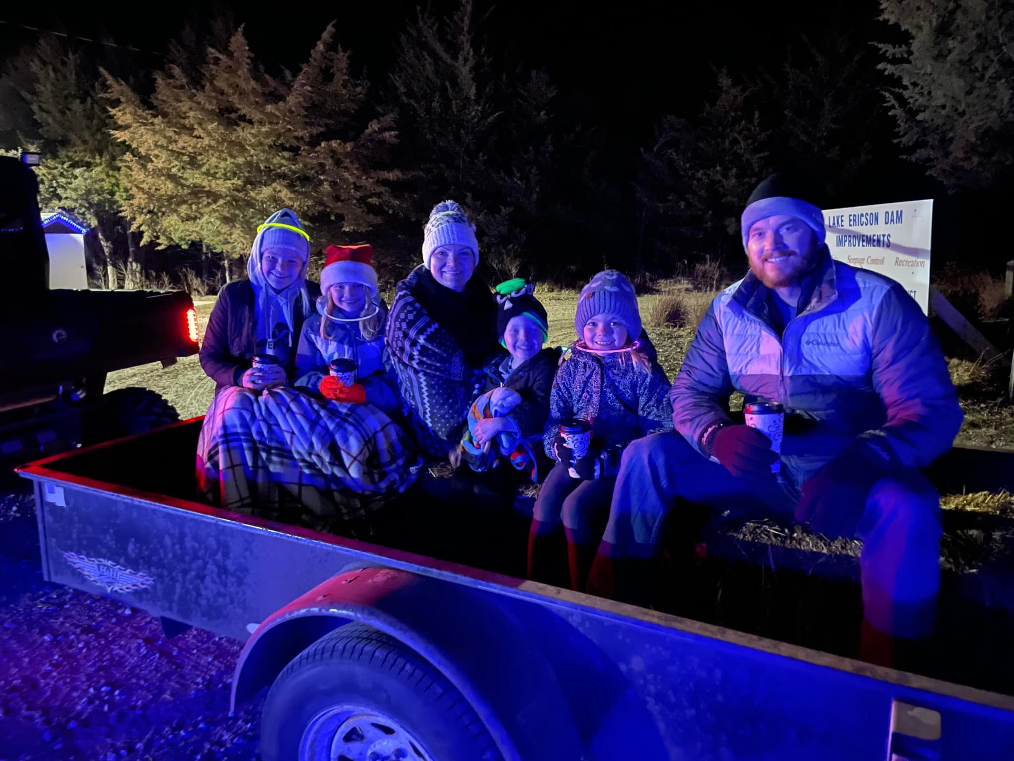 A family on a hayrack ride at Lake Ericson Trail of Lights.
