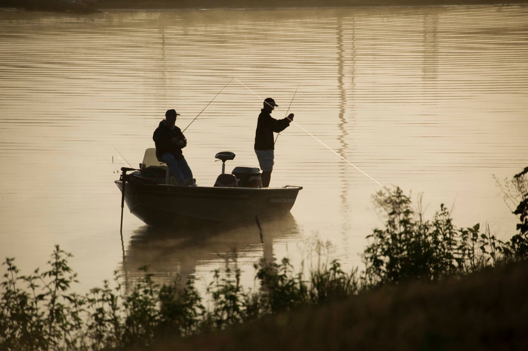 Two anglers on a fishing boat on Lake Wanahoo.