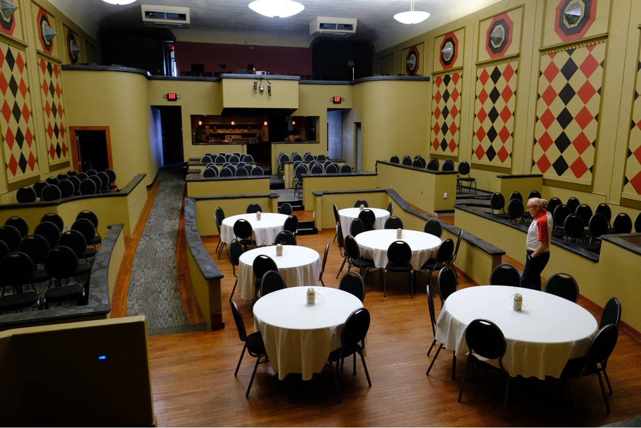Tables and chairs set up at The Golden Husk Theatre in Ord.
