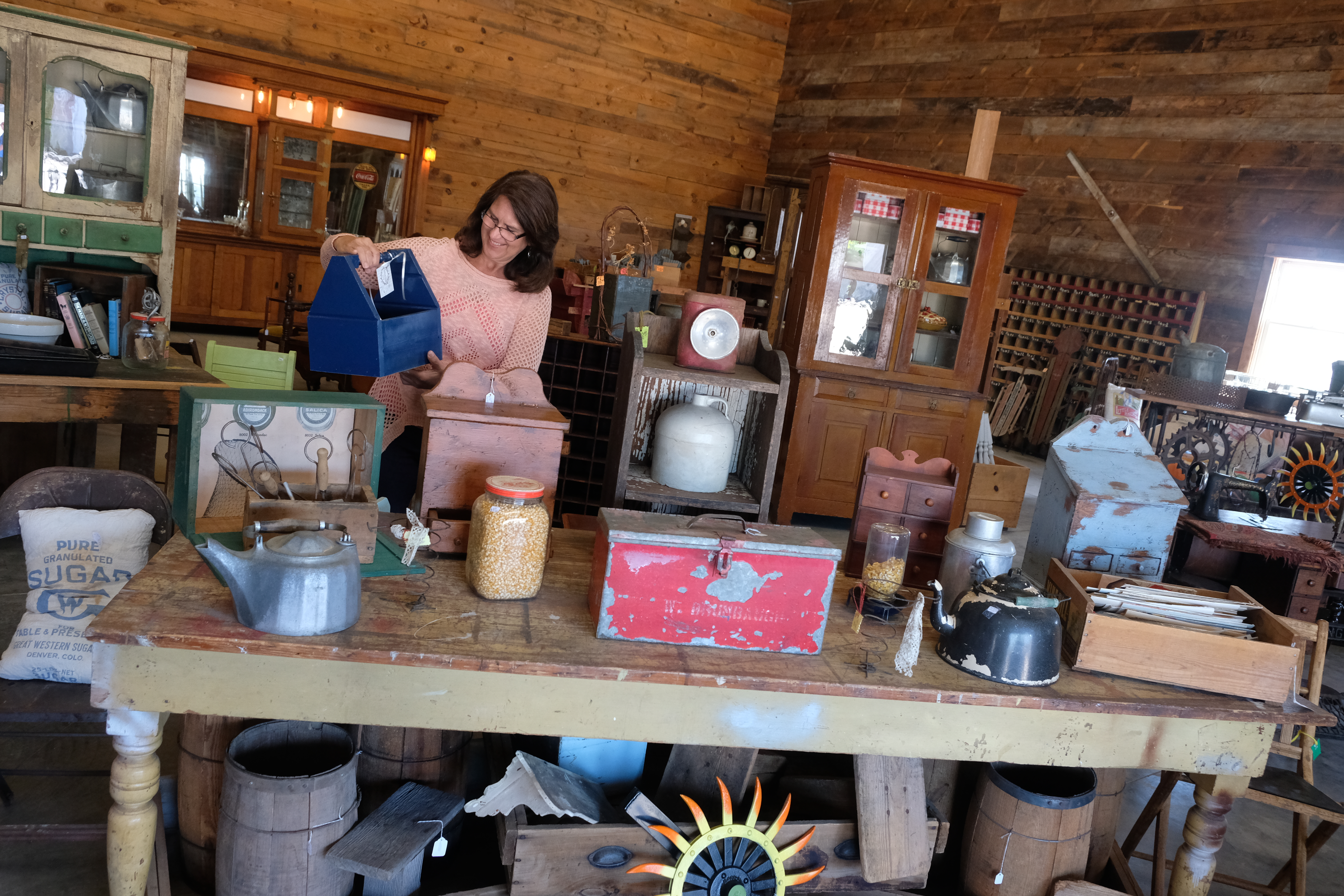 A shopper looking at wares at Grain Bin Antique Town in North Platte