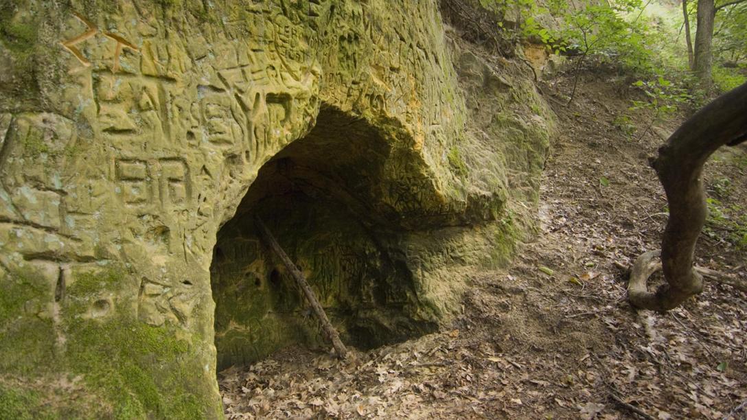 Engravings around a depression in the rock face at Hole in the Rock Recreation Area and Big Elk Park.