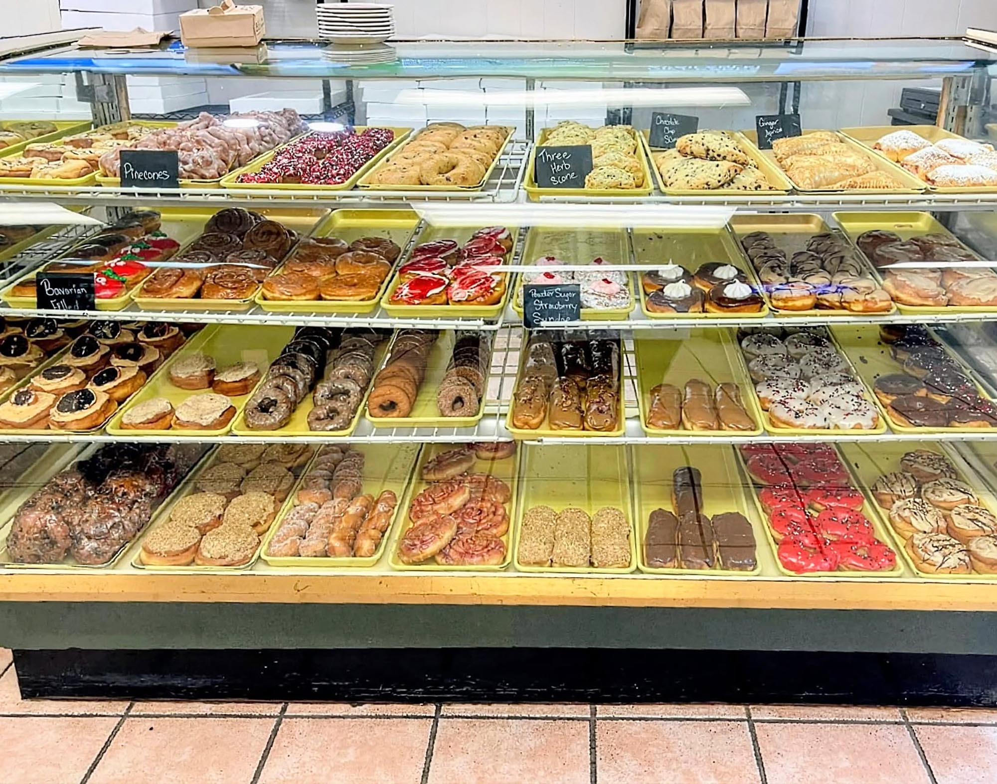 Donut and pastry display case at Lucy's Bakery & Cafe.