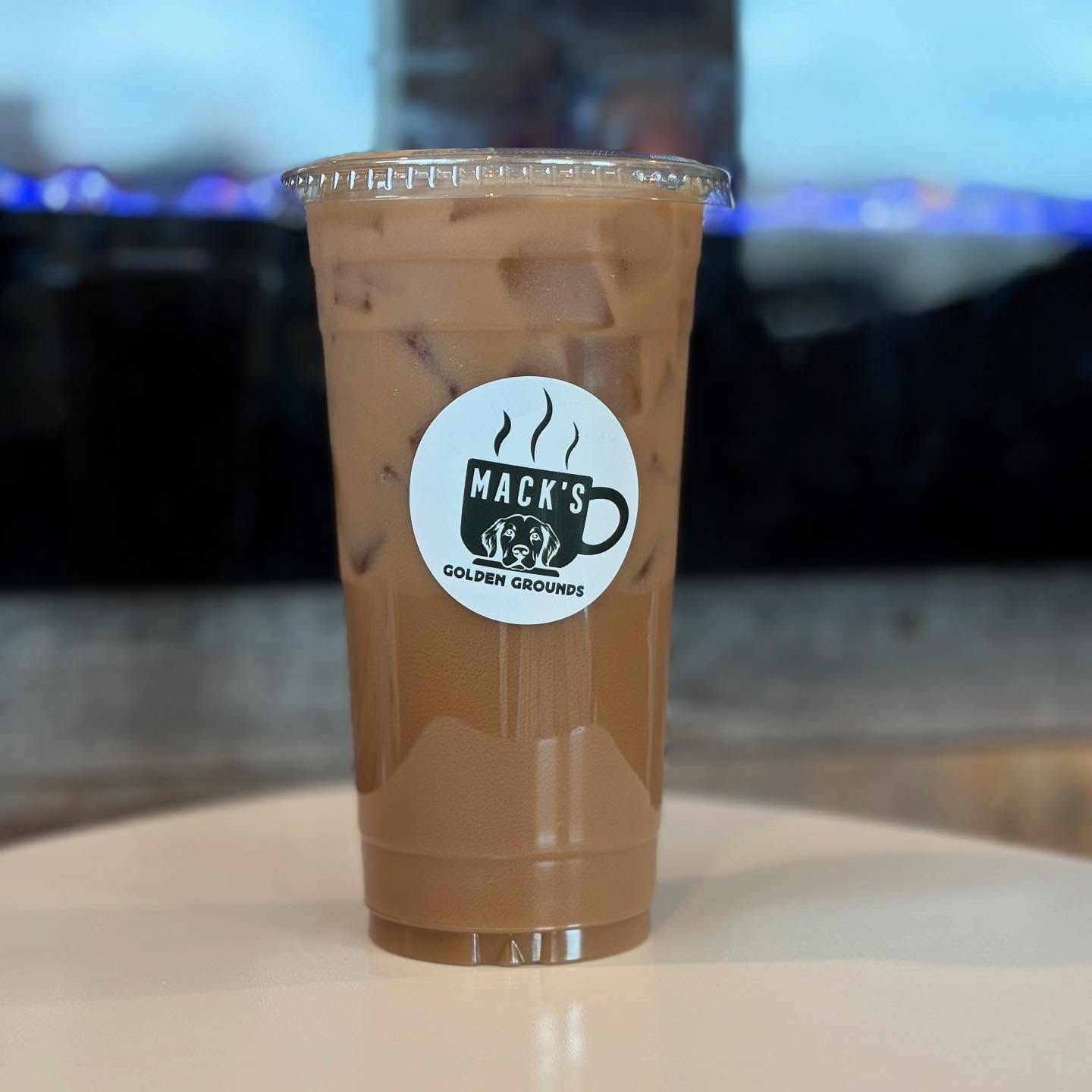 coffee with Mack's Golden Grounds logo
